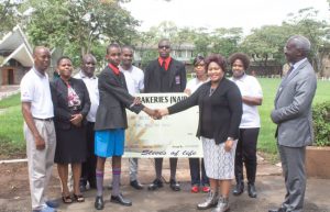 Mini Group employees alongside Starehe Boys Centre representatives during Ksh 1 million donation handover to support education and youth developmen