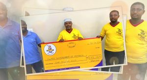 "Supa Loaf team presenting a Ksh 1 million donation cheque to support COVID-19 relief efforts in Mombasa County"